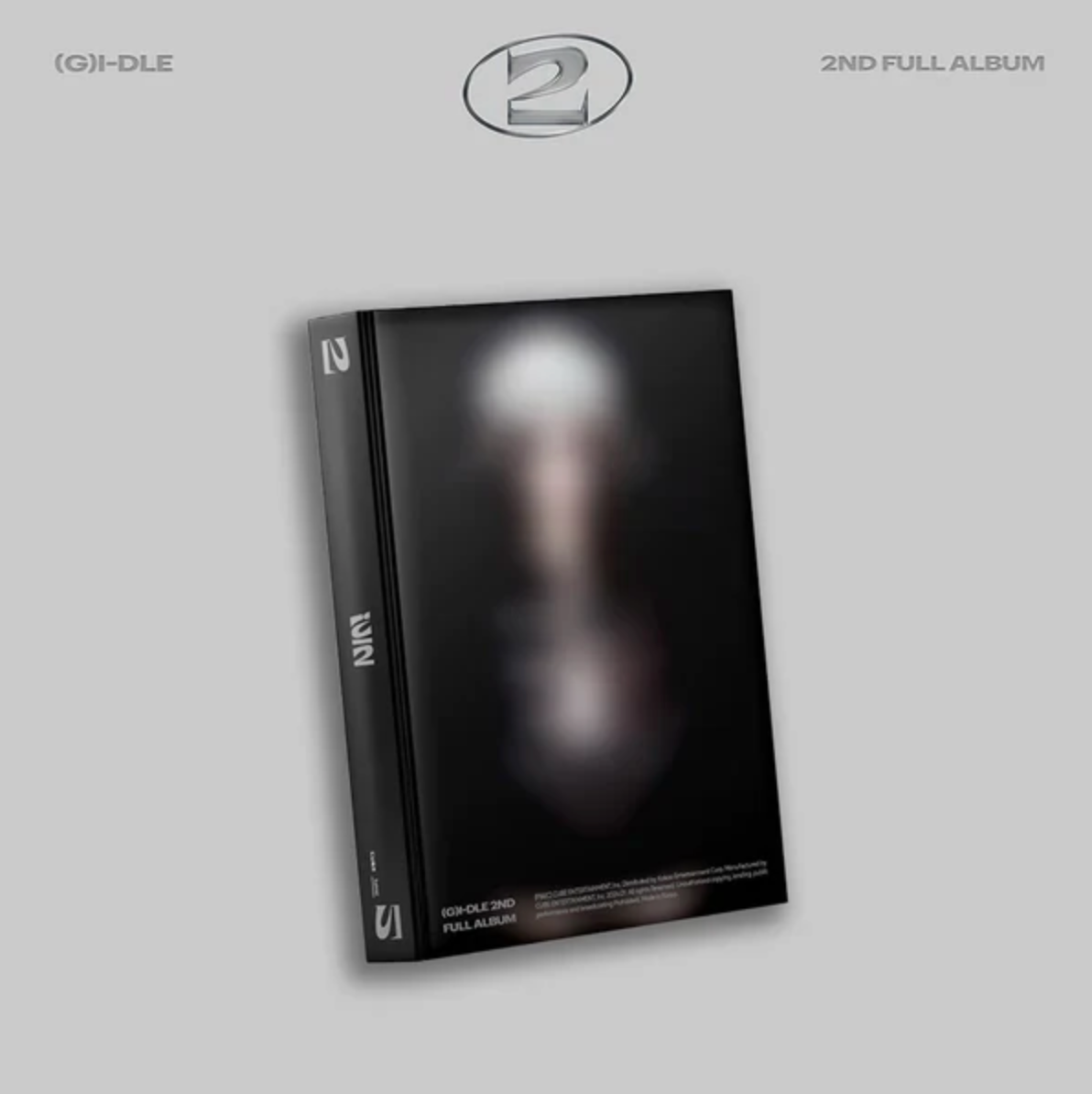 The image shows three versions of the album packaging for (G)I-DLE - 2 (2nd Album). Each version has a different color accent, either blue, pink, or black, on the booklet cover with a minimalistic design featuring the artist's name and album title in both text and a stylized font.