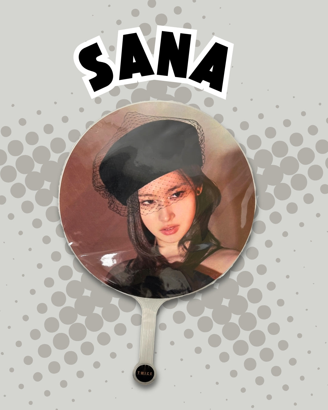 Handheld concert decorative picket with a portrait of a person wearing a black headscarf on a gray background with 'SANA' text.