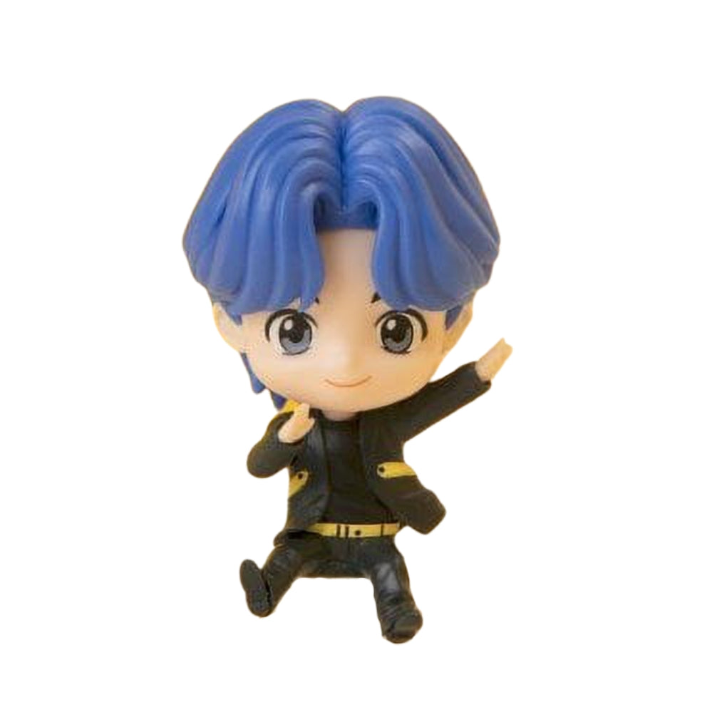 Small figurine of BTS TinyTAN Jungkook with blue hair and black outfit on a white background