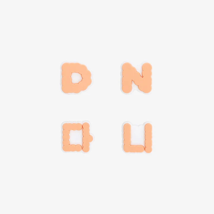 Four letter-shaped New Jeans lightstick accessories on a white background