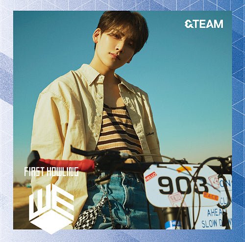 &Team member Yuma with a bicycle against a blue sky, for First Howling album