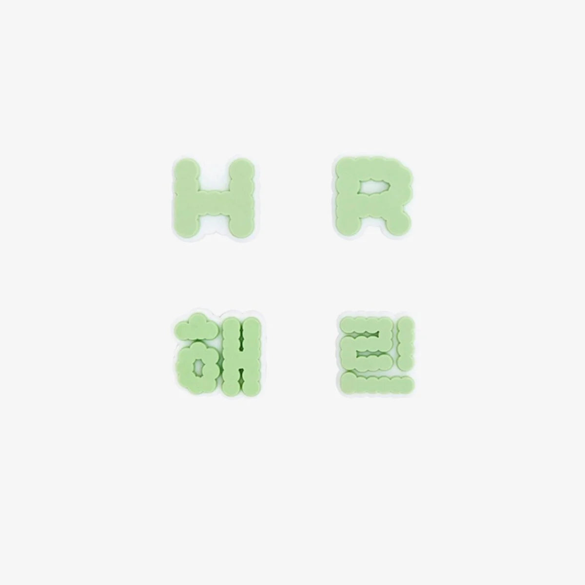 Four letter-shaped New Jeans lightstick accessories on a white background