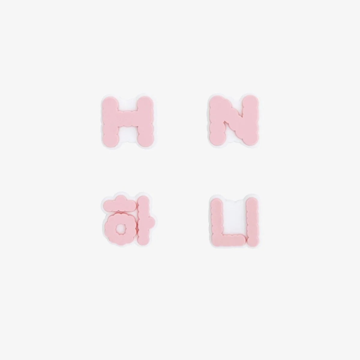 Four letter-shaped New Jeans lightstick accessories on a white background