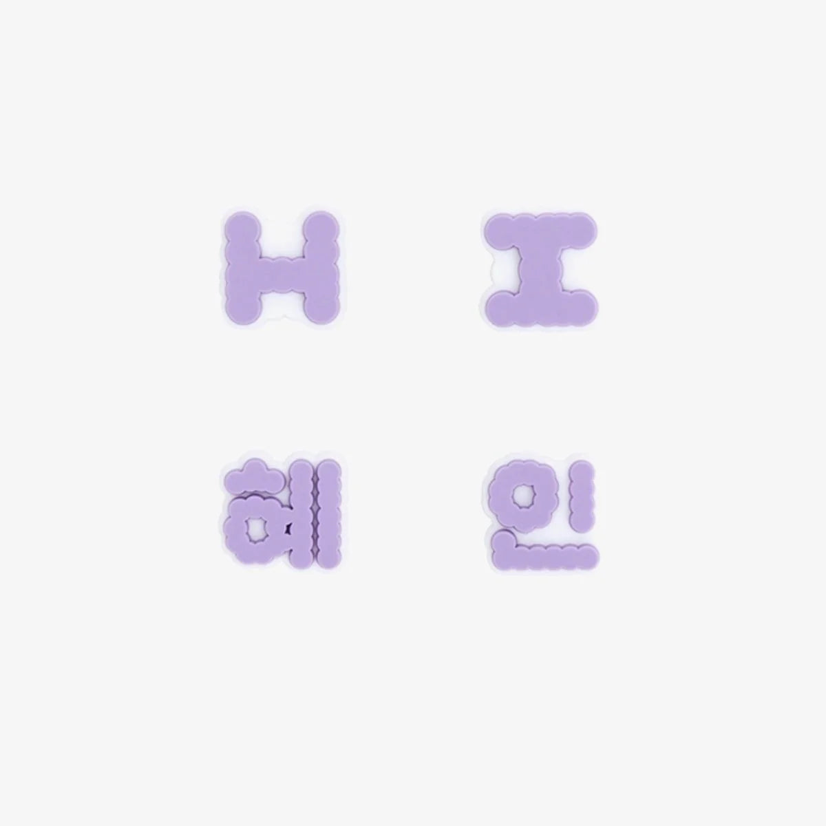 Four letter-shaped New Jeans lightstick accessories on a white background