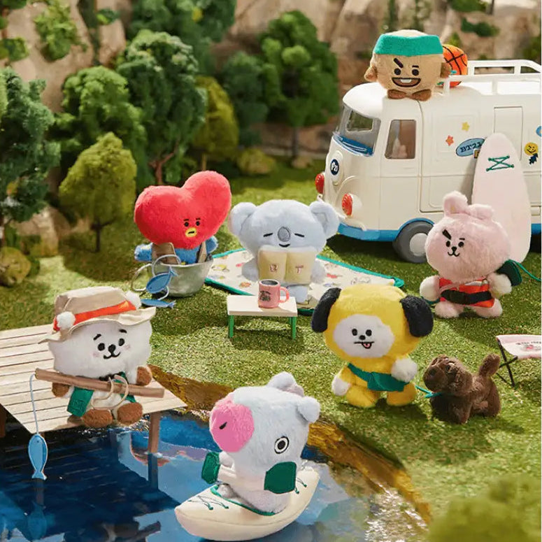 Plush BTS BT21 toys in a camping scene with a van and nature background
