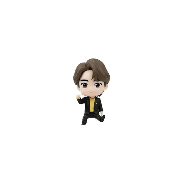 Small BTS TinyTAN Jin figurine of a person in formal attire on a white background