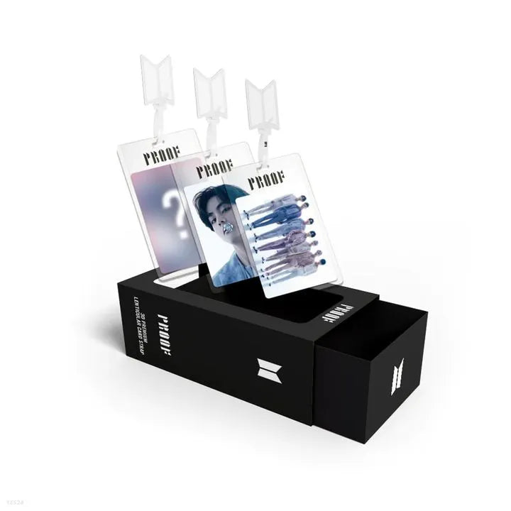 Black box with BTS album 'PROOF' branding containing promotional materials on a white background