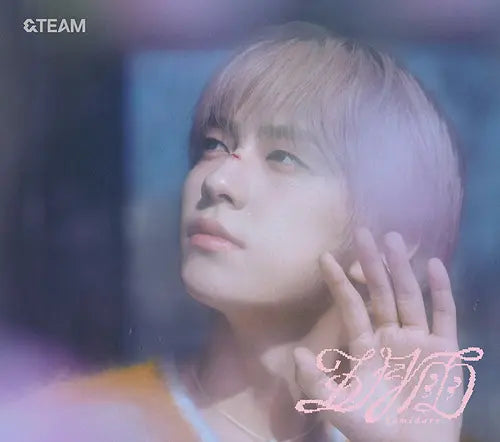 &Team member Taki with light-colored hair looking upwards, with a soft focus background for Samidare album CD
