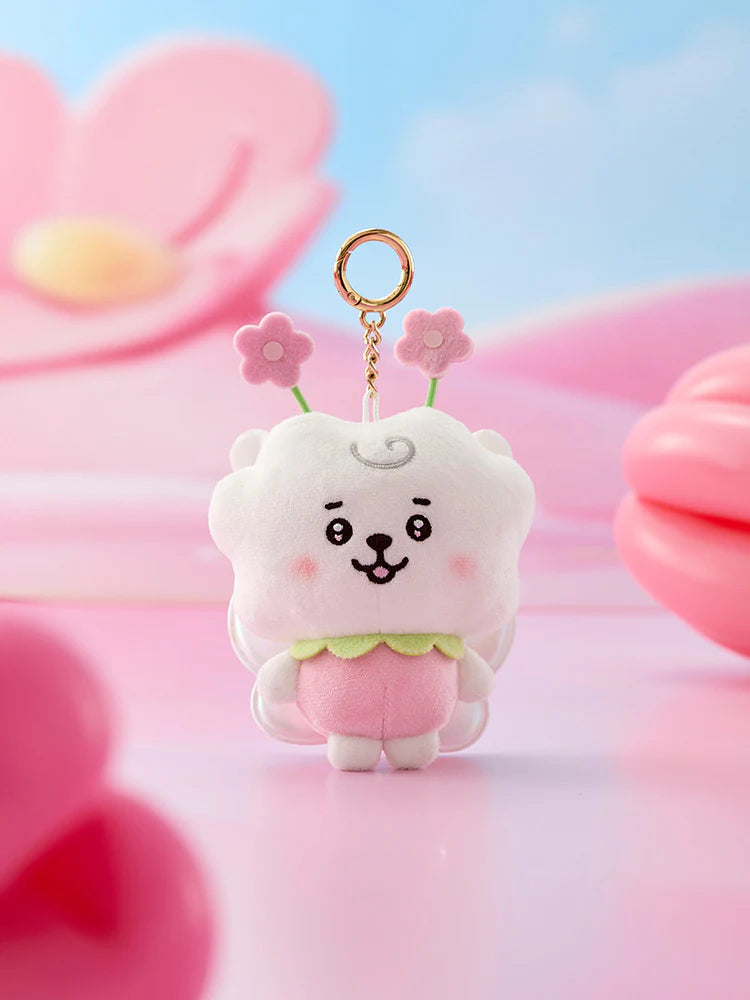 Cute BTS BT21 spring fairy RJ plush keychain with a cartoon design against a soft pink and blue background