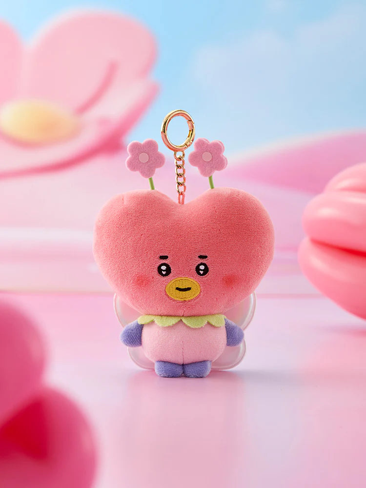 Red heart-shaped spring fairy Tata BTS BT21 plush keychain with flower accents on a soft pink background