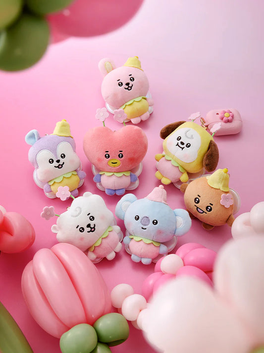 Set of colorful spring fairy cartoon character from BTS BT21 line figurines or plushies on a pink background