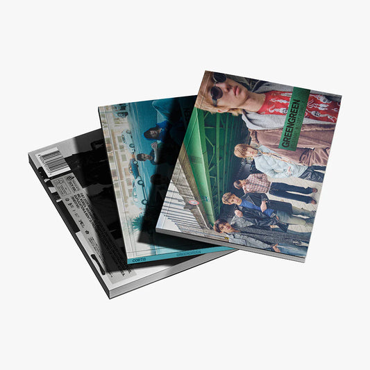 Three photo albums with different cover designs on a white background for Cortis Green Green album